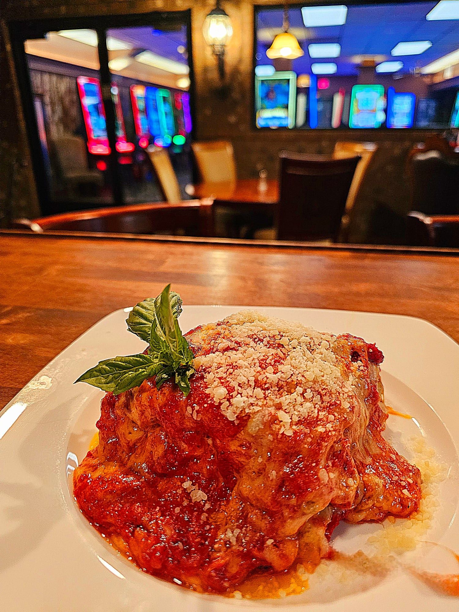 Lasagna with red sauce and parmesan on the bar